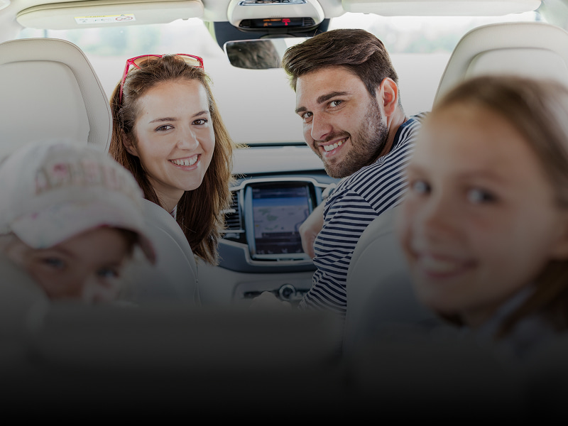 Happy Family Doing A Road Trip Looking Over