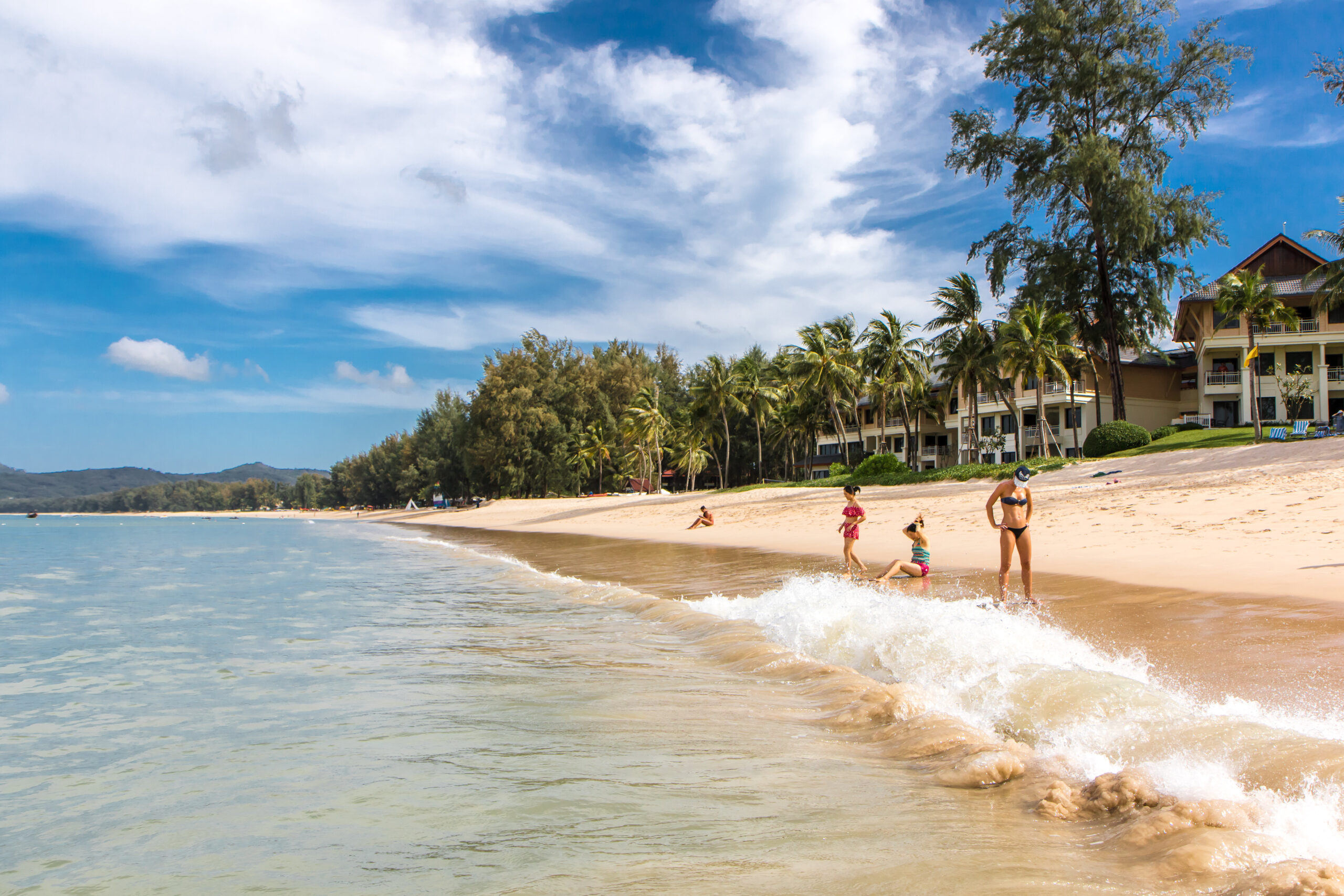 Family enjoying Bang Tao Beach near Blue Tree Phuket in Cherng Talay