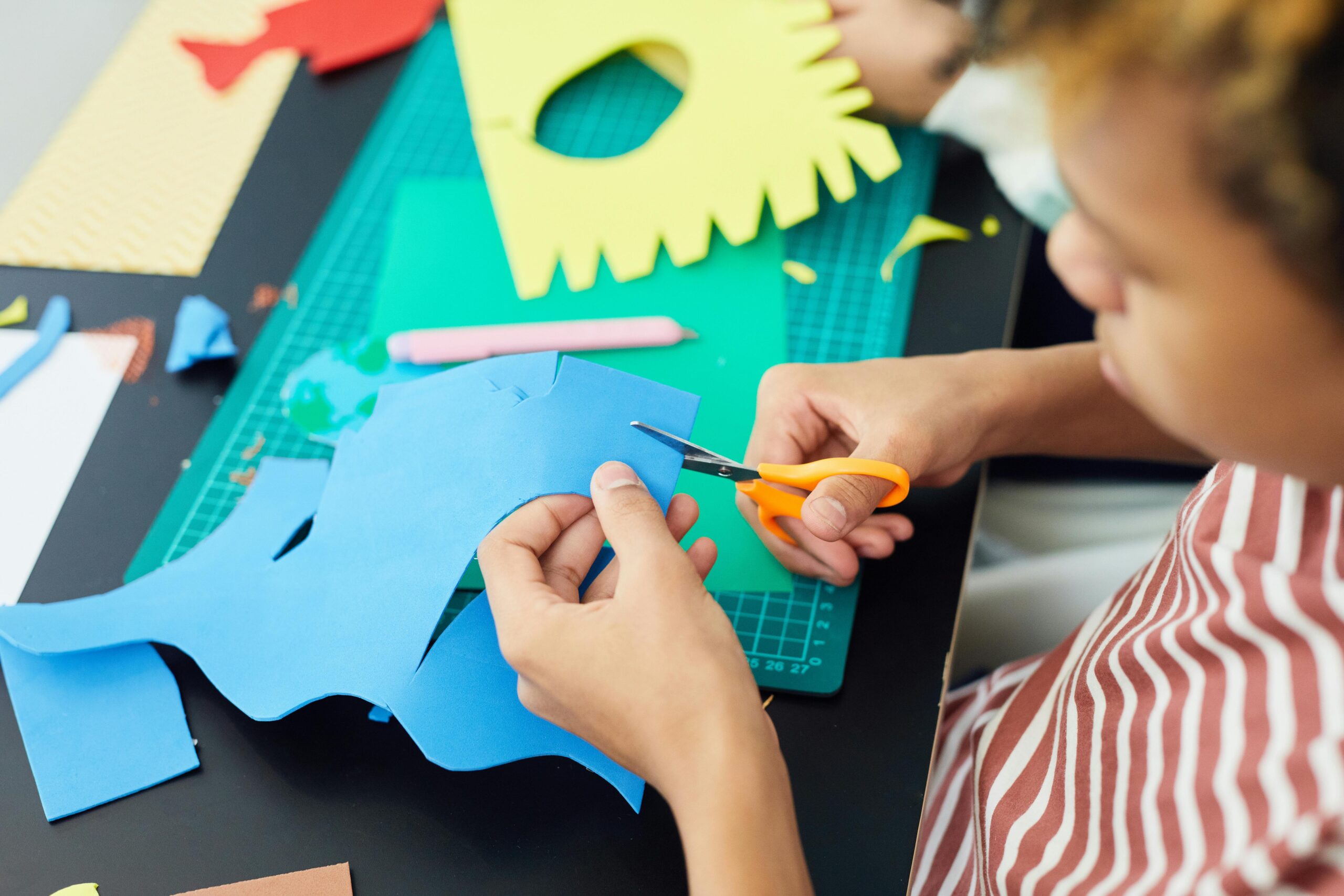 Child enjoying a creative craft activity at an indoor play area in Phuket