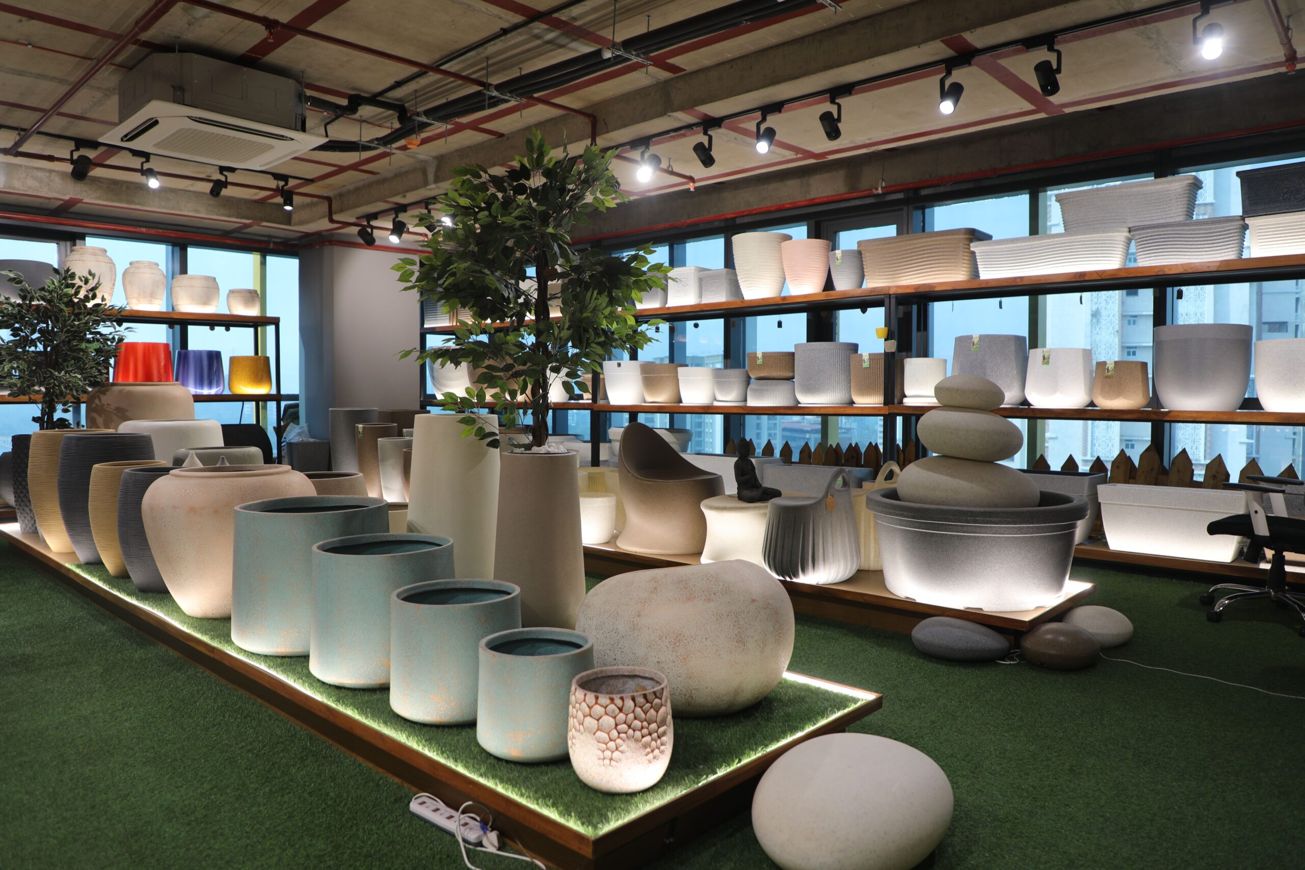 Shelves of home decor items including lighting and kitchenware inside a well-designed home store in Phuket